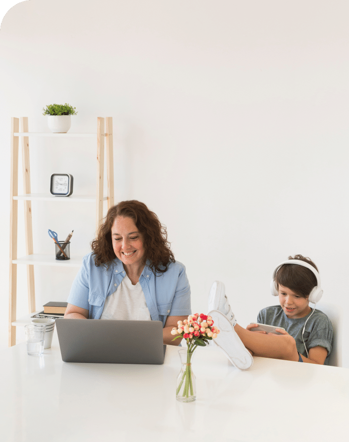 mother-with-child-working-laptop 1